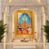 Swaminarayan Maharaj in elaborate gold and red devotional attire, framed by ornate temple pillars and flower offerings.